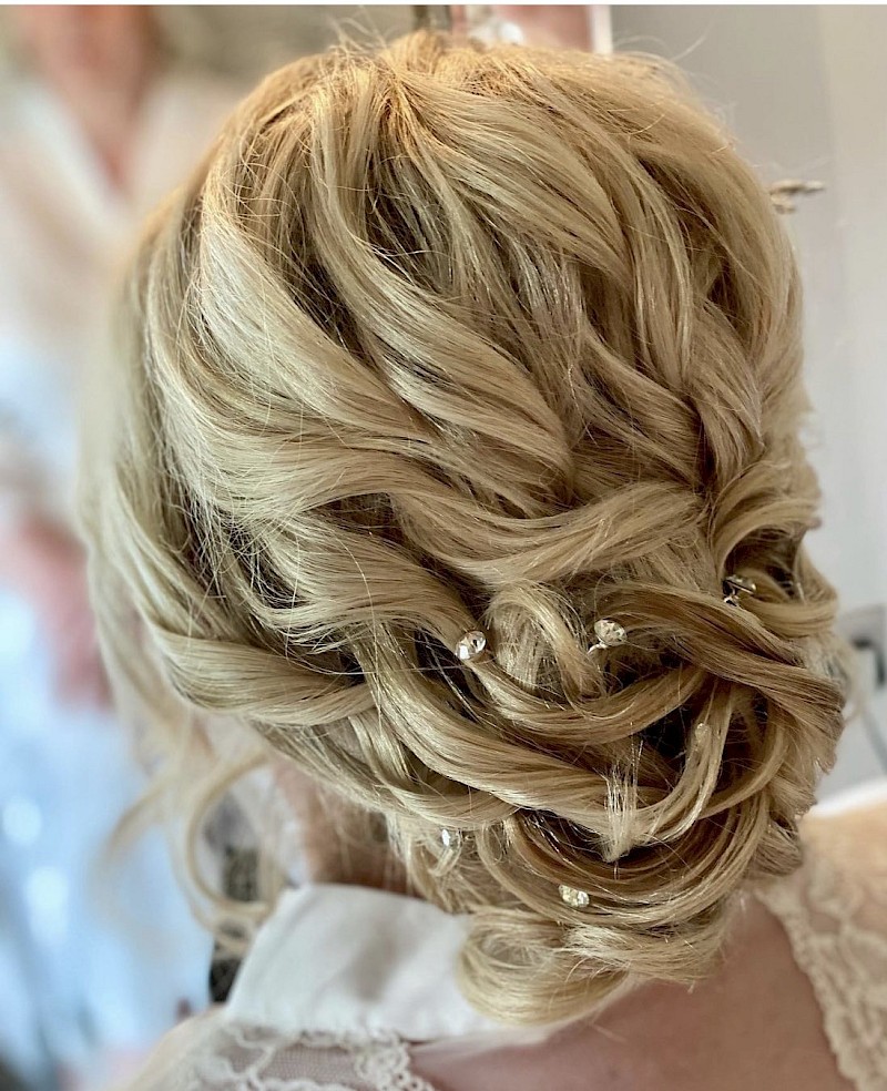 Textured low bun at Elegant Hair and Beauty Bridal Hair and Makeup Suffolk